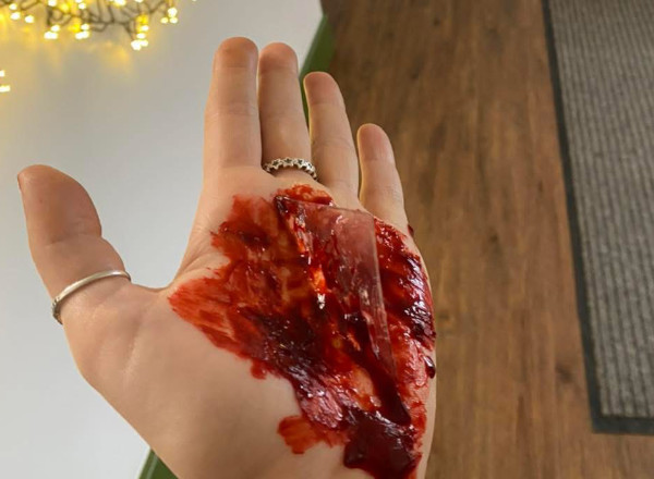 A hand made to look as though it has glass stuck in it for the purpose of training.